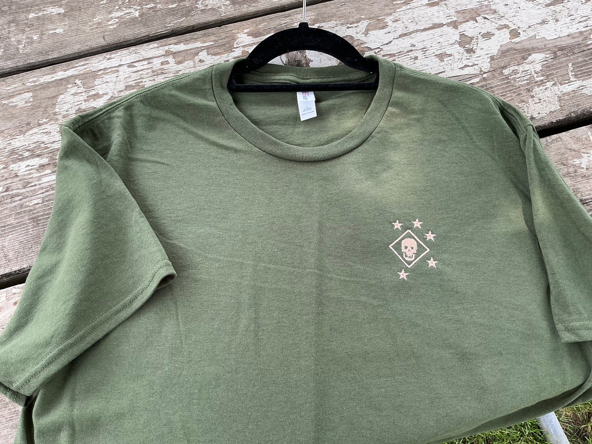 Green short sleeved shirt with Marine Raider logo